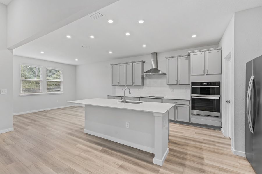 Dogwood Plan Lot 581 Chef's Kitchen Next to Breakfast Area at NorthShore in Kingsland