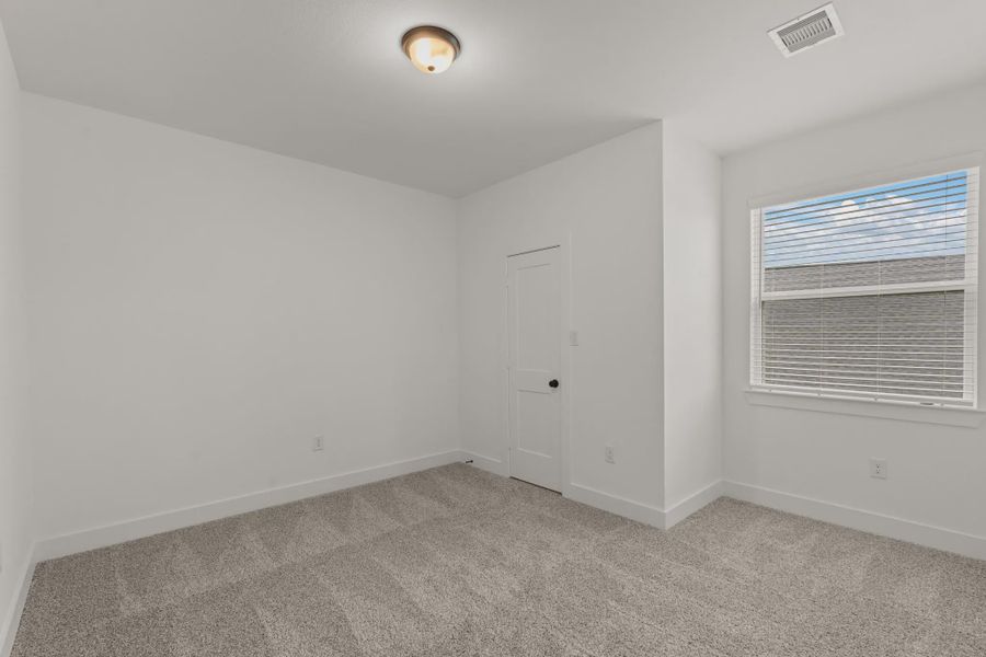 Representative unfurnished interior of a home built from the Sorenstam by Chesmar Homes in Riceland Alley Loads, Mont Belvieu (Image 78).