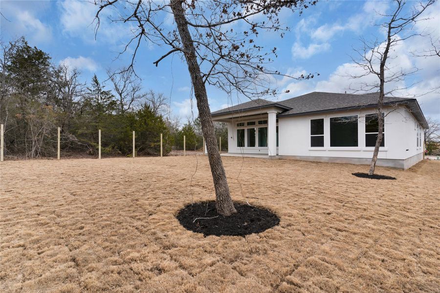 Rear view of house with roof with shingles