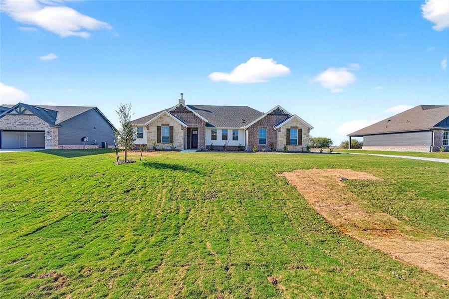Front exterior of a new home in Fairview Meadows, New Fairview, TX, highlighting curb appeal (Image 21). Front exterior of a new home in Fairview Meadows, New Fairview, TX, highlighting curb appeal (Image 21).