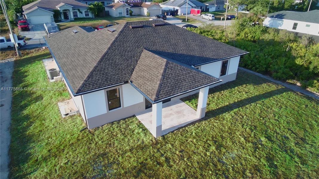 Front exterior of a new home in , Lehigh Acres, FL, highlighting curb appeal (Image 1).
