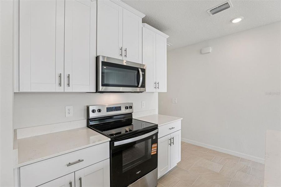 Furnished interior view inside a new home in Cagan Crossings West, Clermont (Image 5).
