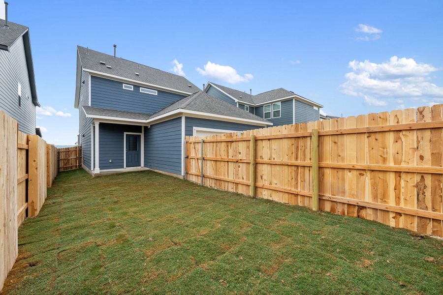 Exterior details and patio area of a home in The Cottages at Lariat, Liberty Hill (Image 29).