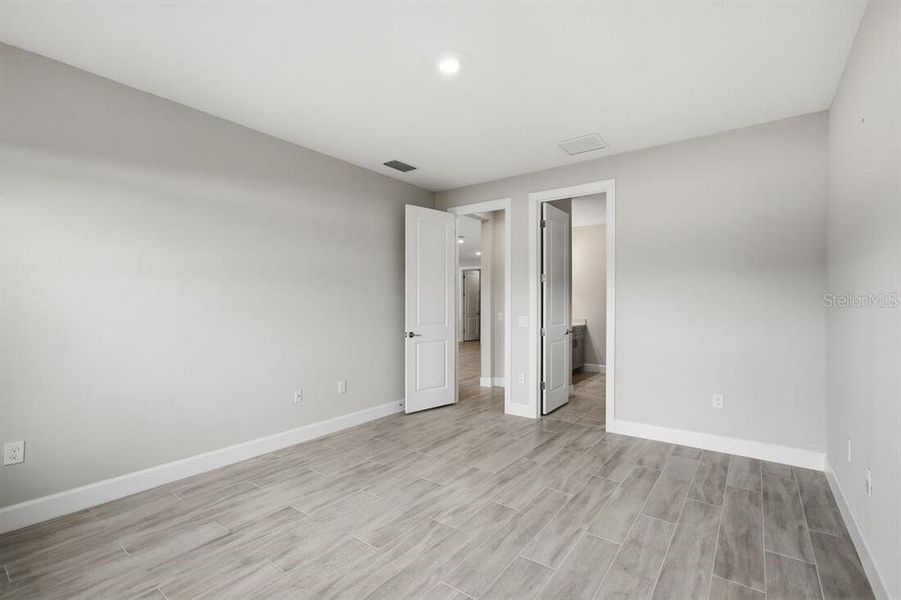 Spacious, unfurnished interior of a new home in Esplanade at Westview, Kissimmee (Image 18).