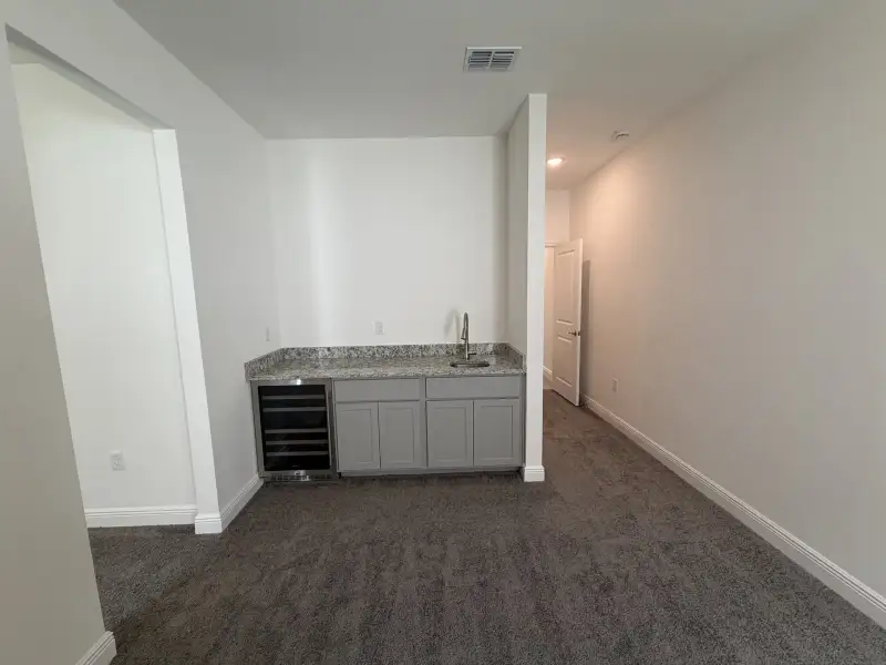Furnished interior view inside a new home in Malabar Springs, Palm Bay (Image 8).