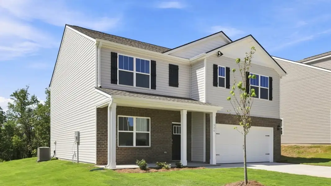 Front exterior of a new home in Woodglen, Piedmont, SC, highlighting curb appeal (Image 2). Front exterior of a new home in Woodglen, Piedmont, SC, highlighting curb appeal (Image 2).