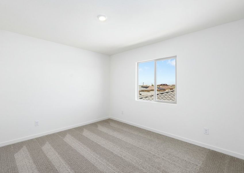 Each bedroom is filled with natural light from large windows.