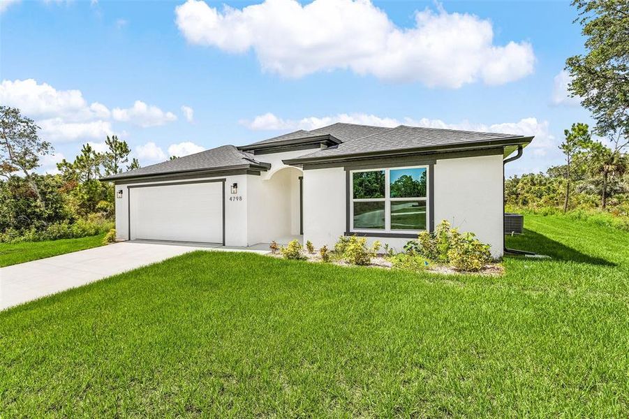 Front exterior of a new home in , North Port, FL, highlighting curb appeal (Image 2).