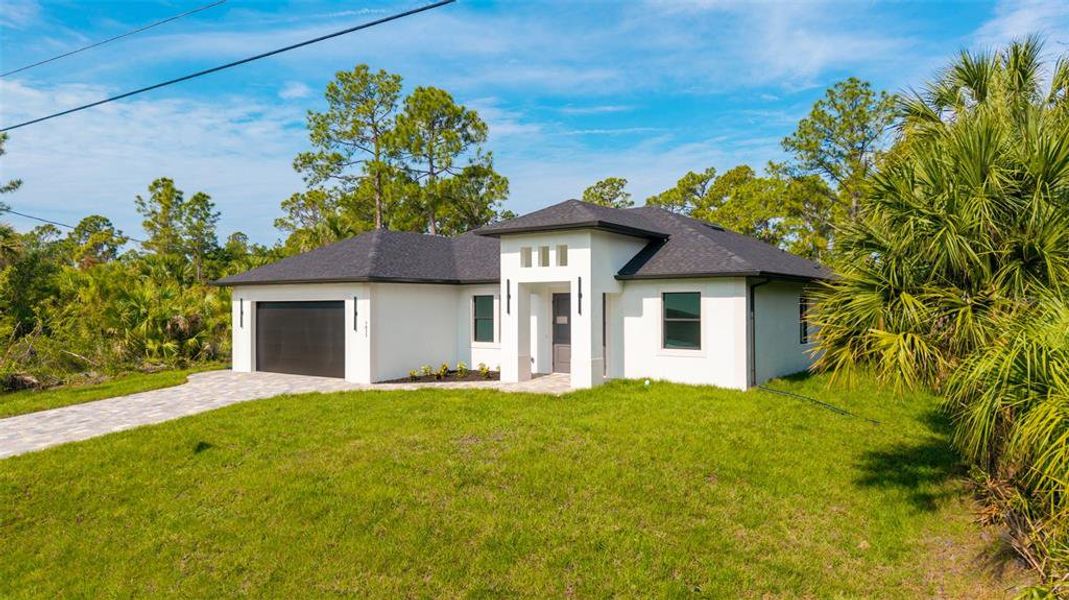 Front exterior of a new home in , North Port, FL, highlighting curb appeal (Image 32). Front exterior of a new home in , North Port, FL, highlighting curb appeal (Image 32).