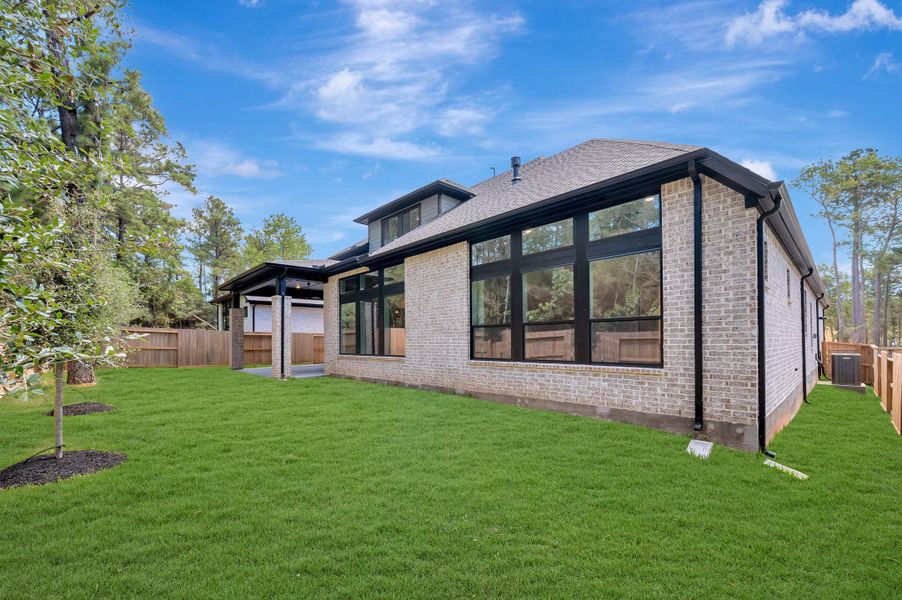 Exterior details and patio area of a home in The Woodlands Hills - Premier Collection, Willis (Image 3).