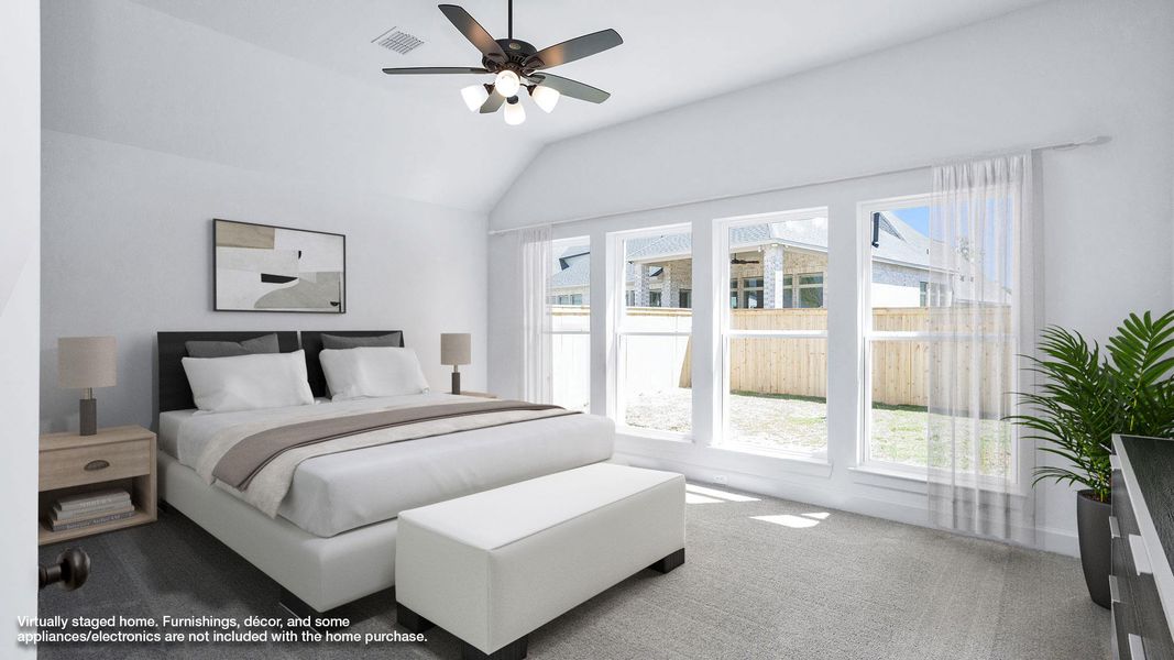 Bedroom featuring carpet flooring, ceiling fan, visible vents, and vaulted ceiling Bedroom featuring carpet flooring, ceiling fan, visible vents, and vaulted ceiling