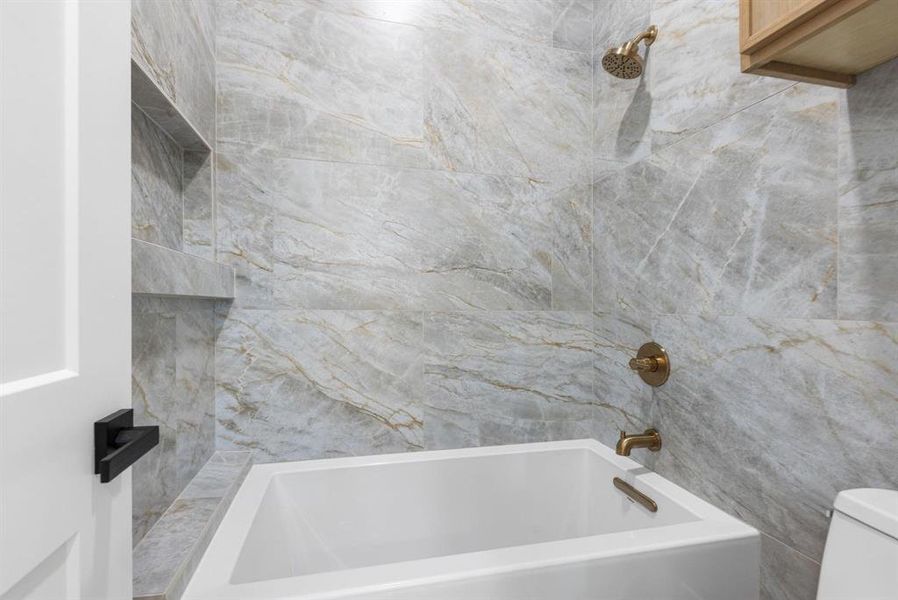 Full bath with shower / washtub combination and
toilet Full bath with shower / washtub combination and
toilet