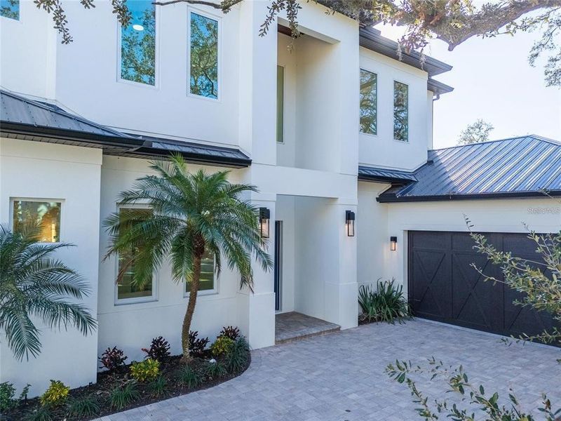 Front exterior of a new home in , Sarasota, FL, highlighting curb appeal (Image 25).