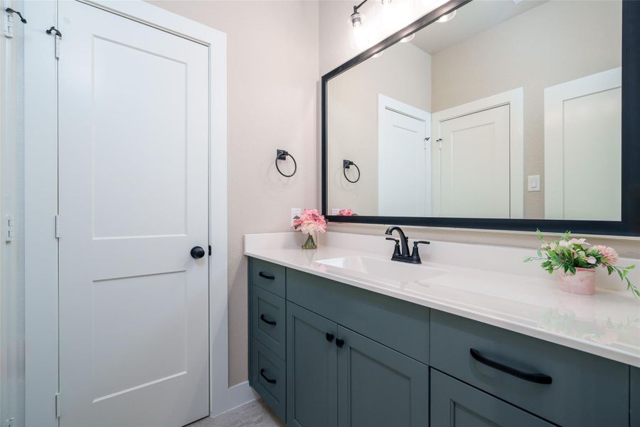 This convenient guest feature includes a private sink with easy access to a shared bathroom, offering both comfort and privacy for visitors. This convenient guest feature includes a private sink with easy access to a shared bathroom, offering both comfort and privacy for visitors.