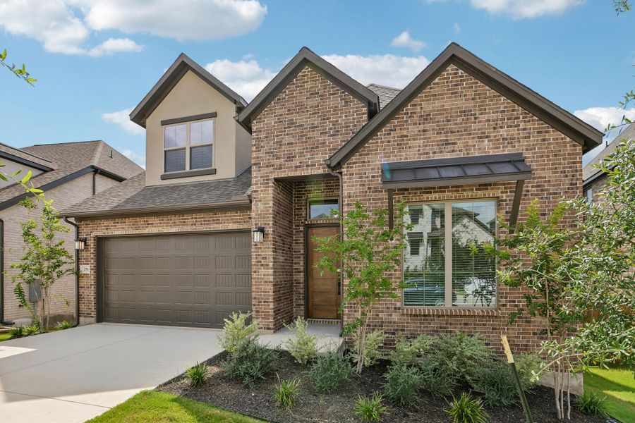 Front exterior of a new home in 6 Creeks, Kyle, TX, highlighting curb appeal (Image 19).
