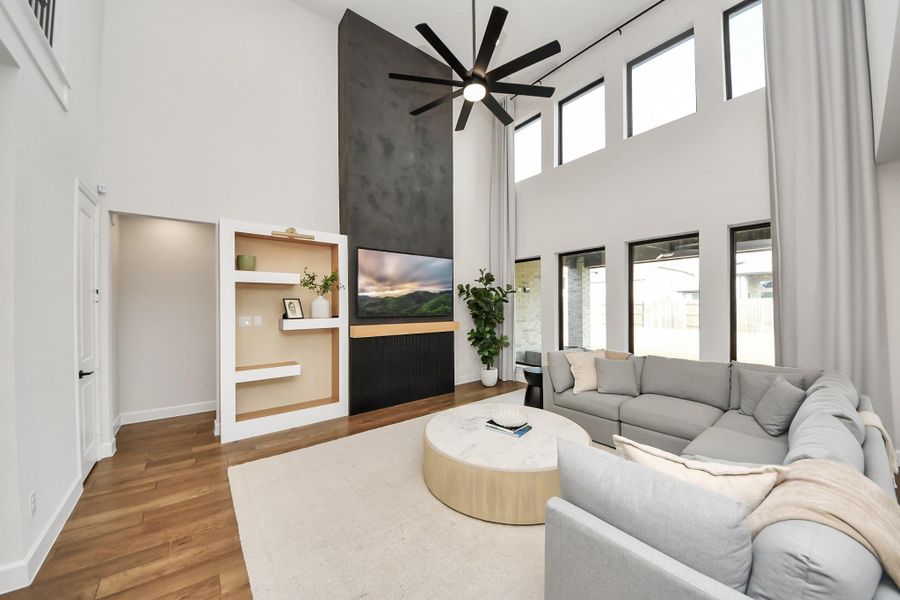 Open-concept living space with soaring ceilings and custom accent features.