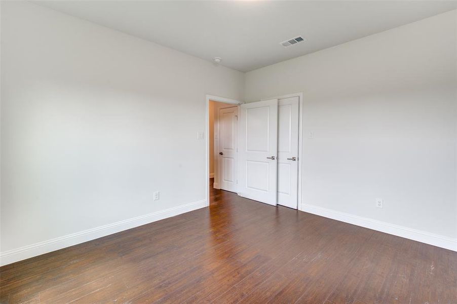 Unfurnished room featuring hardwood / wood-style floors