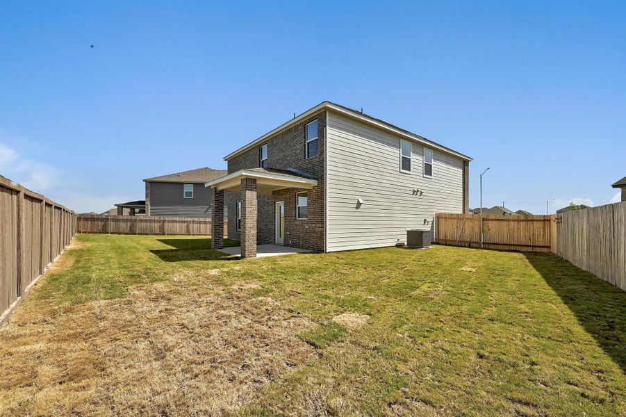 Front exterior of a new home in Centerpoint Meadows, Lockhart, TX, highlighting curb appeal (Image 17).