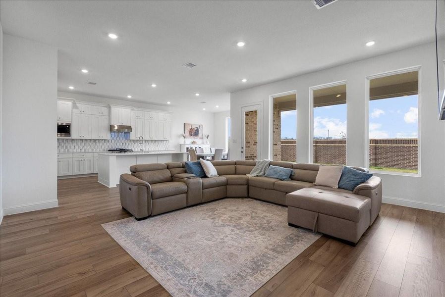 Spacious living room open to the kitchen for easy everyday living and gatherings. Spacious living room open to the kitchen for easy everyday living and gatherings.