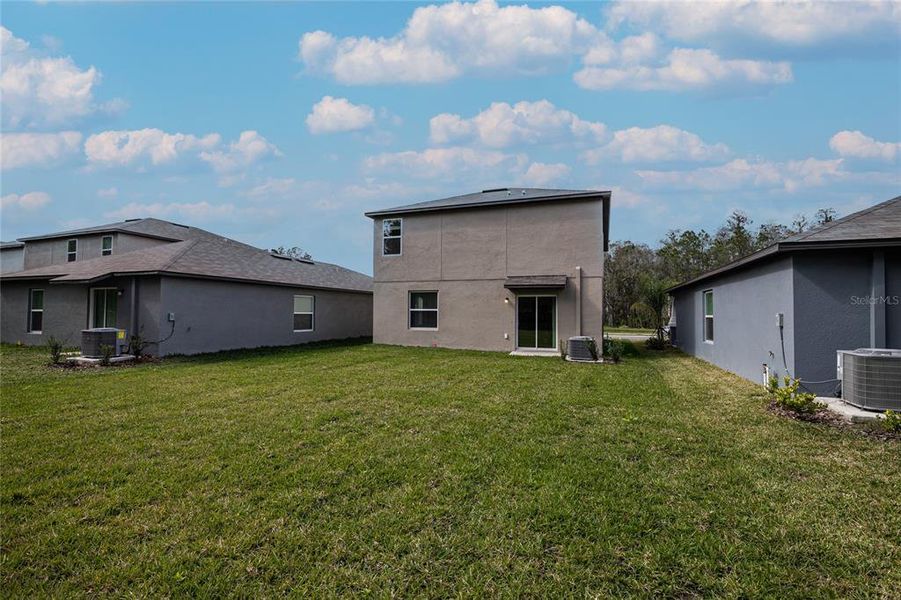 Exterior details and patio area of a home in Saddle Creek Preserve: The Manors II, Lakeland (Image 4).