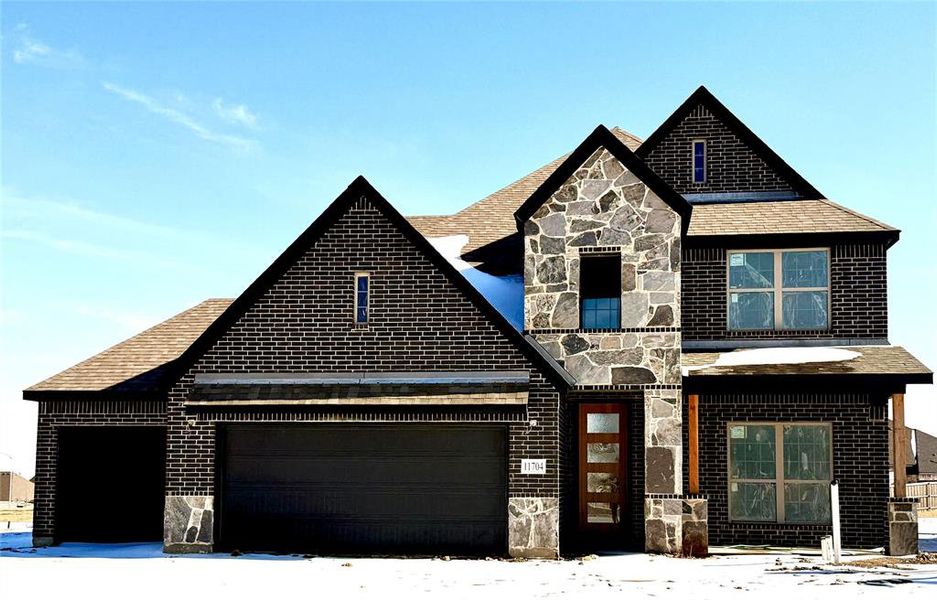 Front exterior of a new home in , Godley, TX, highlighting curb appeal (Image 1). Front exterior of a new home in , Godley, TX, highlighting curb appeal (Image 1).