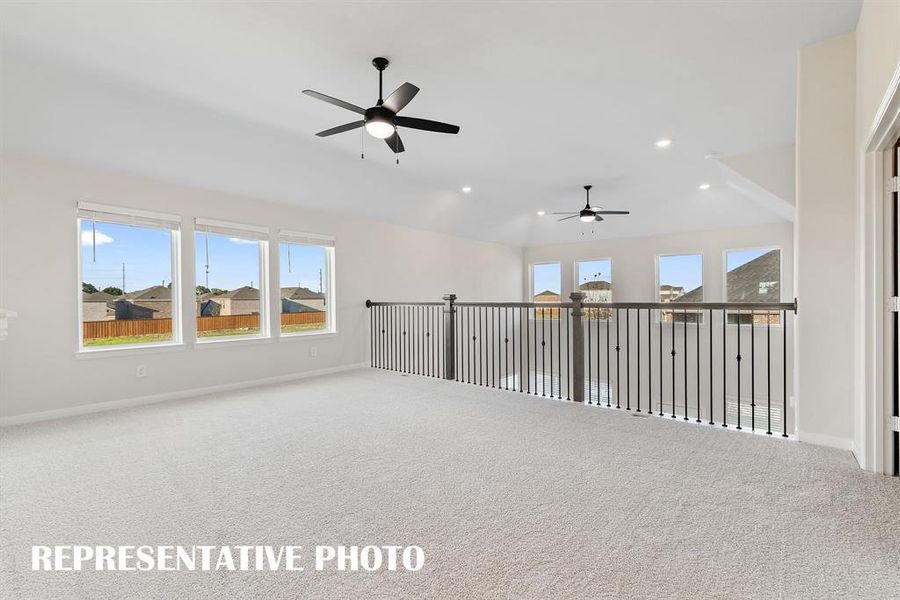 Light, bright and airy, the family fun time never ends in this over the top game room!  REPRESENTATIVE PHOTO