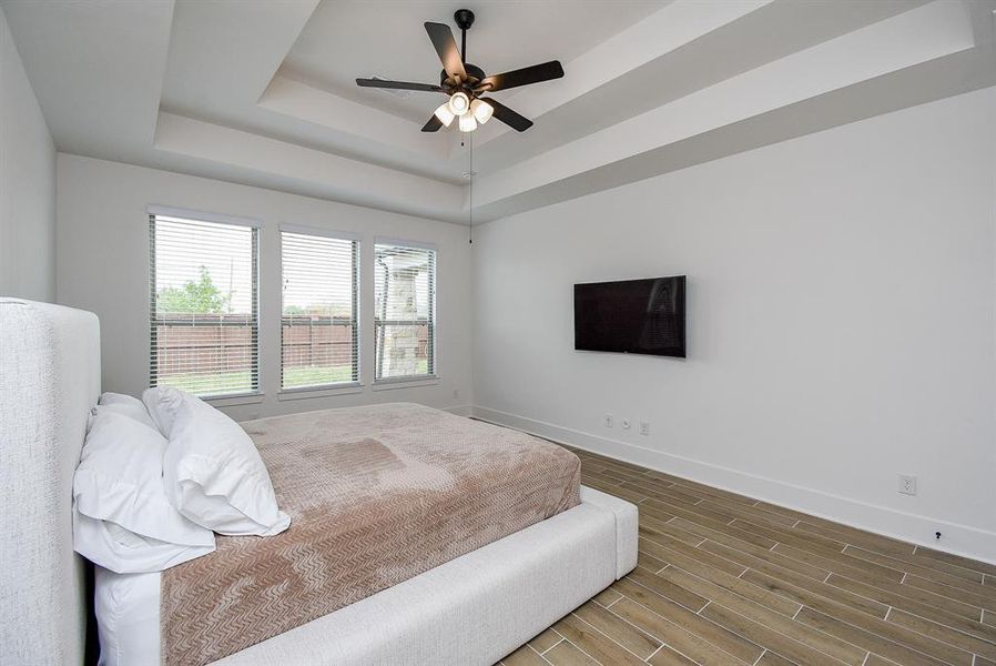 The wood-like tile flooring provides a warm and inviting aesthetic while being durable and easy to maintain. This suite creates a tranquil retreat, perfect for relaxation and unwinding after a long day.