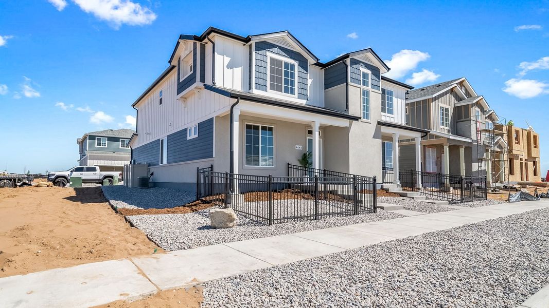 Front exterior of a new home in Green Valley Ranch, Aurora, CO, highlighting curb appeal (Image 2). Front exterior of a new home in Green Valley Ranch, Aurora, CO, highlighting curb appeal (Image 2).