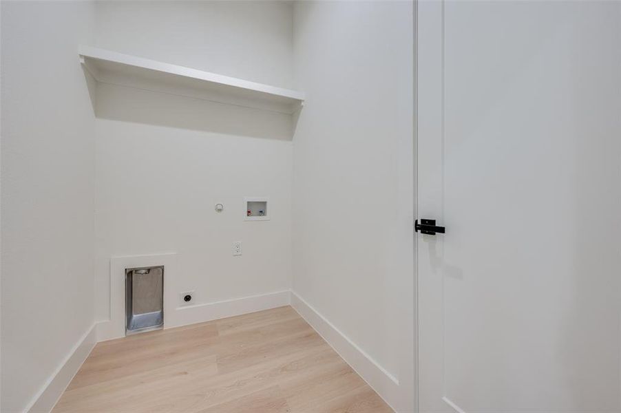 Washroom with electric dryer hookup, light hardwood / wood-style floors, gas dryer hookup, and hookup for a washing machine