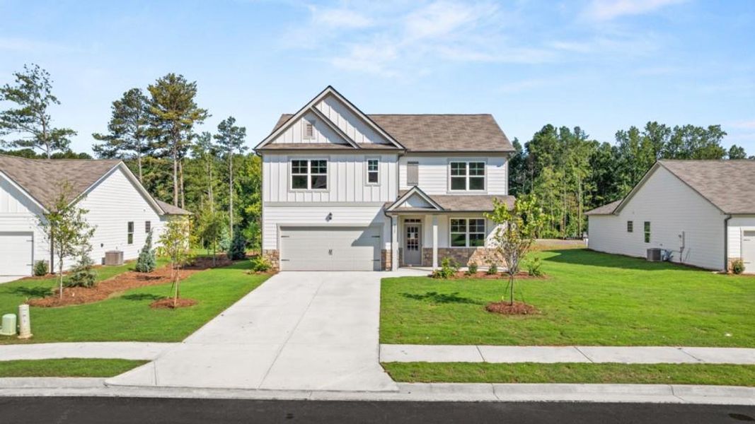 Front exterior of a new home in Fairhaven, Lithia Springs, GA, highlighting curb appeal (Image 27). Front exterior of a new home in Fairhaven, Lithia Springs, GA, highlighting curb appeal (Image 27).