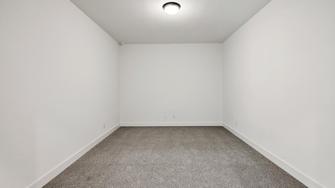 Unfurnished room featuring carpet flooring and baseboards Unfurnished room featuring carpet flooring and baseboards