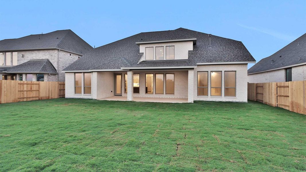 Exterior details and patio area of a home in Elyson 65', Katy (Image 3).