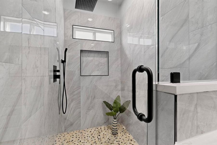 Bathroom featuring a shower stall Bathroom featuring a shower stall