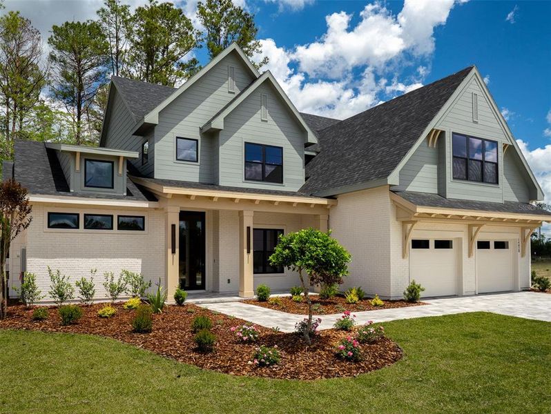 Front exterior of a new home in Laureate Village, Newberry, FL, highlighting curb appeal (Image 2). Front exterior of a new home in Laureate Village, Newberry, FL, highlighting curb appeal (Image 2).