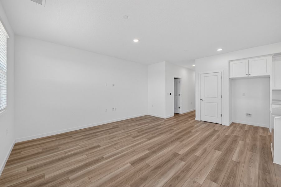 A room with white walls and wood floors. A room with white walls and wood floors.