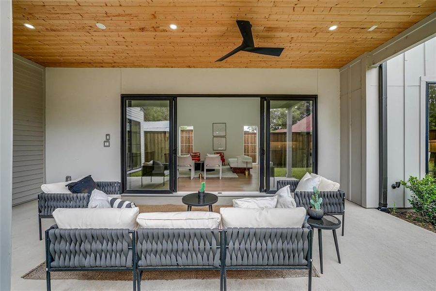 Covered patio featuring a wood-finish ceiling, recessed lighting, and a ceiling fan