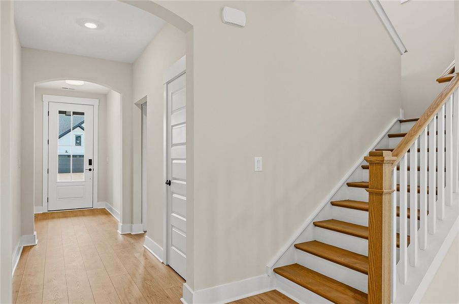 Smooth wood floors guide the way from the entry ha