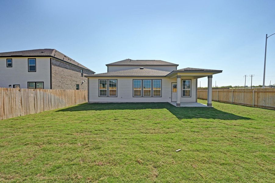 Exterior details and patio area of a home in Mustang Valley, Manor (Image 4). Exterior details and patio area of a home in Mustang Valley, Manor (Image 4).
