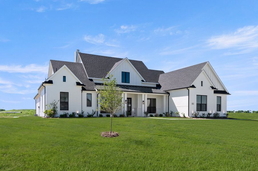 Front exterior of a new home in Byrum Ranch - 1 Acre Lots, Maypearl, TX, highlighting curb appeal (Image 20).