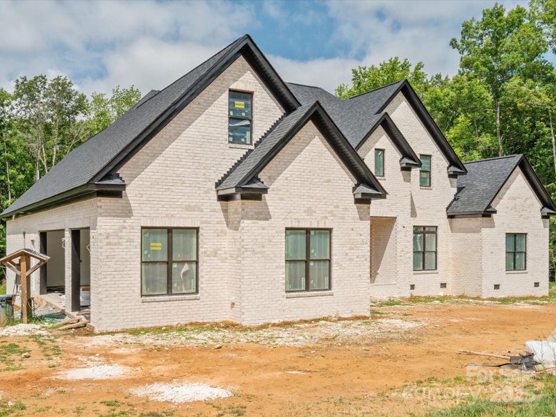 Front exterior of a new home in , Waxhaw, NC, highlighting curb appeal (Image 1).