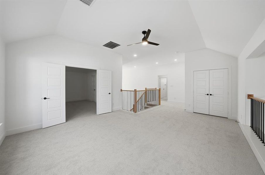 Bonus room with lofted ceiling, light colored carpet, a ceiling fan, and recessed lighting Bonus room with lofted ceiling, light colored carpet, a ceiling fan, and recessed lighting