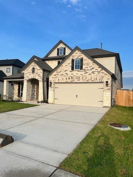 Front exterior of a new home in Morton Creek Ranch, Katy, TX, highlighting curb appeal (Image 1). Front exterior of a new home in Morton Creek Ranch, Katy, TX, highlighting curb appeal (Image 1).