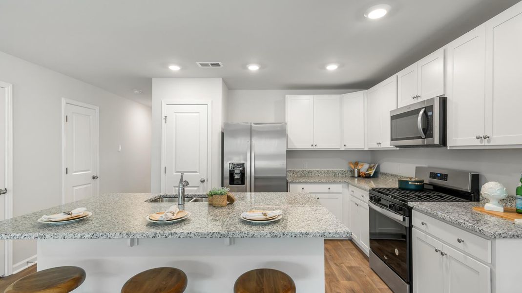 Furnished interior view inside a new home in Pine Hills Townhomes at Cane Bay, Summerville (Image 10).