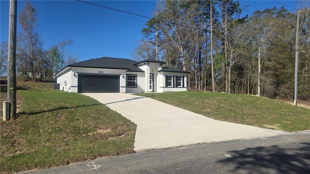 Front exterior of a new home in , Citrus Springs, FL, highlighting curb appeal (Image 18).