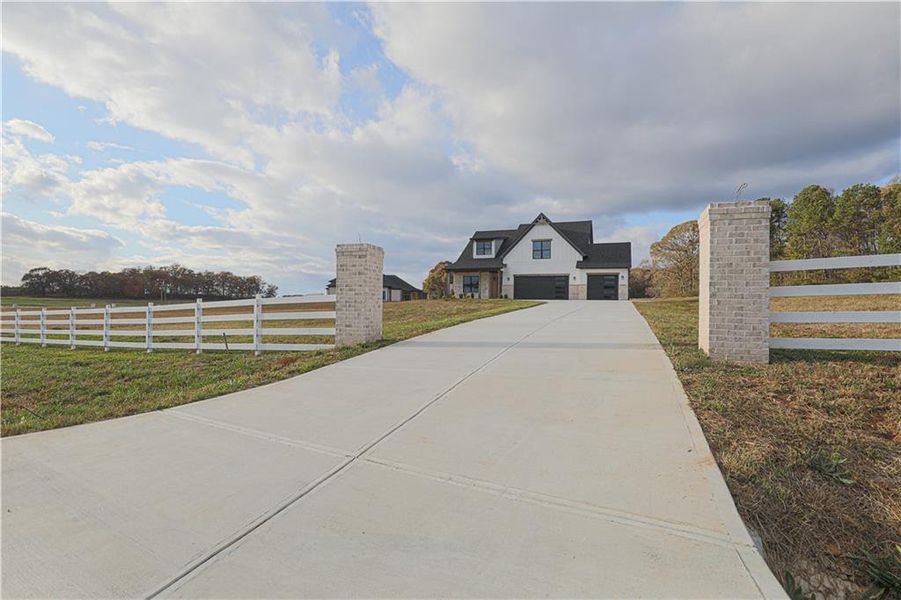 Front exterior of a new home in , Maysville, GA, highlighting curb appeal (Image 1). Front exterior of a new home in , Maysville, GA, highlighting curb appeal (Image 1).