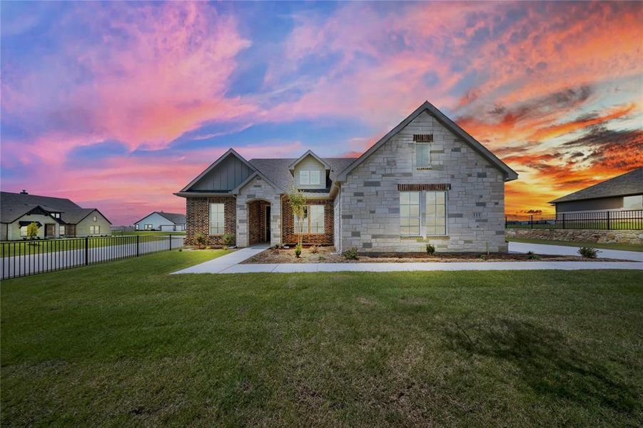 French country style house with brick siding and board and batten siding French country style house with brick siding and board and batten siding