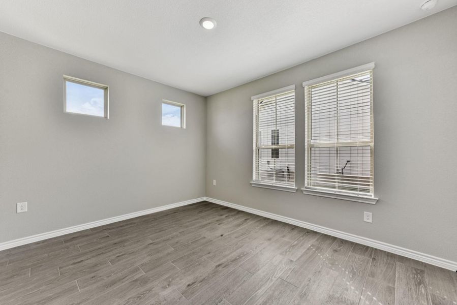 Unfurnished room featuring light wood finished floors and recessed lighting Unfurnished room featuring light wood finished floors and recessed lighting