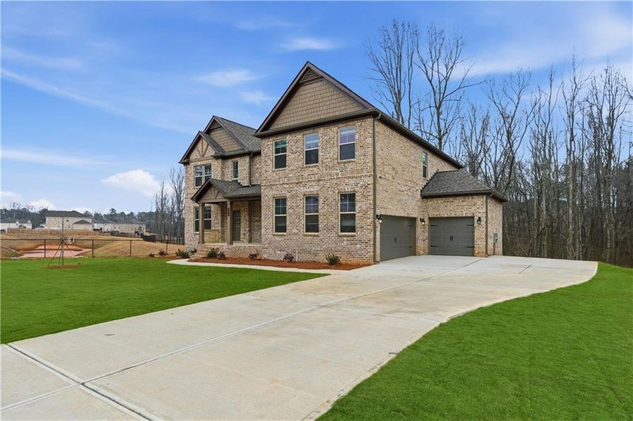 Front exterior of a new home in Trinity Park, McDonough, GA, highlighting curb appeal (Image 18).