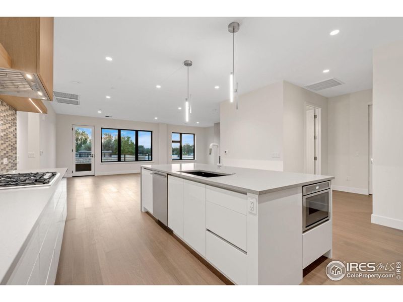 From the kitchen, look straight out to views of the Rocky Mountains. Each kitchen comes stocked with Thermador appliances and features plenty of space from Genesis Innovations Cabinetry.