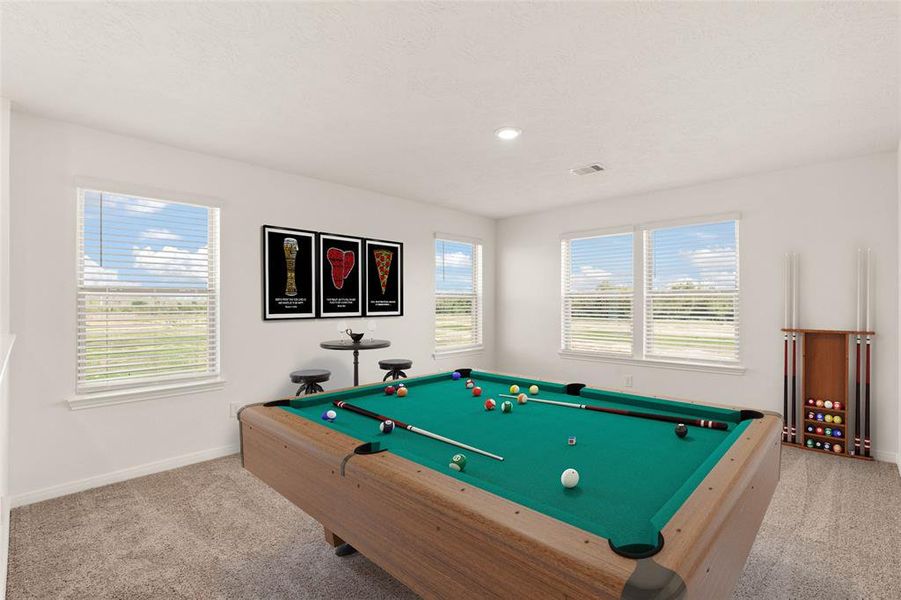 Come upstairs and enjoy a day of leisure in this fabulous game room! This is the perfect hangout spot or adult game room, this space features plush carpet, high ceiling, recessed lighting, and neutral paint.